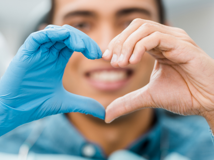 patient making heart shape with hands