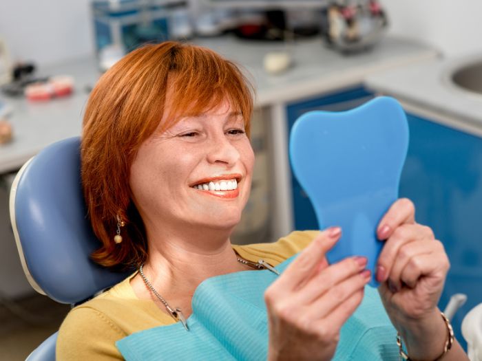 senior woman with new dental implants